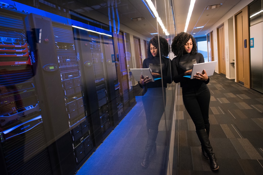 Engineer monitoring Northwind's logistics routing agent beside live server racks